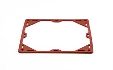 Das Bild zeigt eine dünne, rechteckige Rahmendichtung aus Kunststoff in einem dunklen Rotton mit diversen Aussparungen.